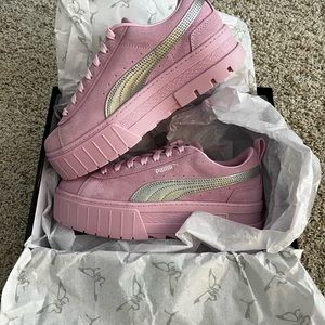 Dua Lipa and PUMA collab pink platform sneakers.